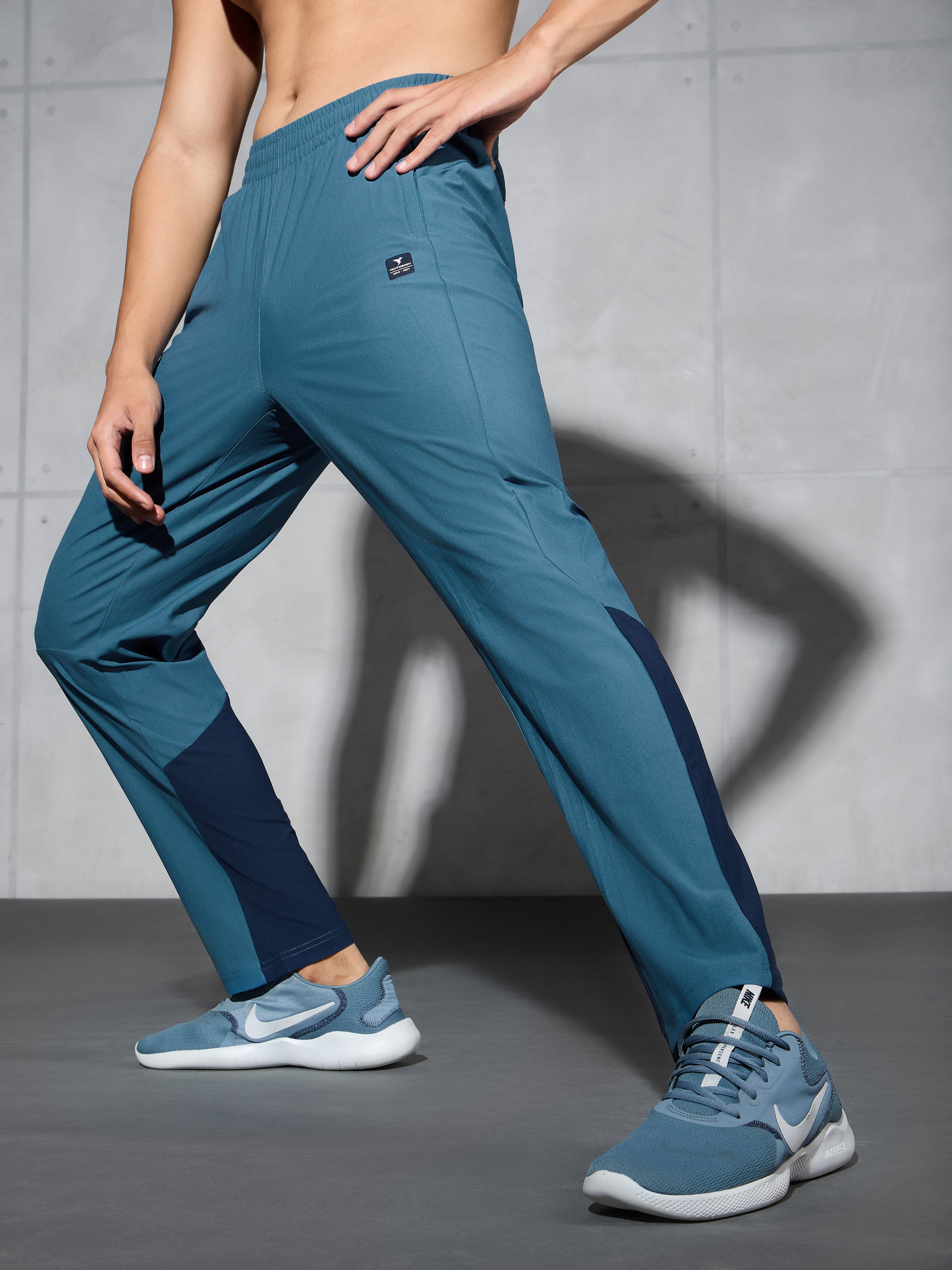 Men Solid Straight Fit Sports Trackpants with DURACOOL+