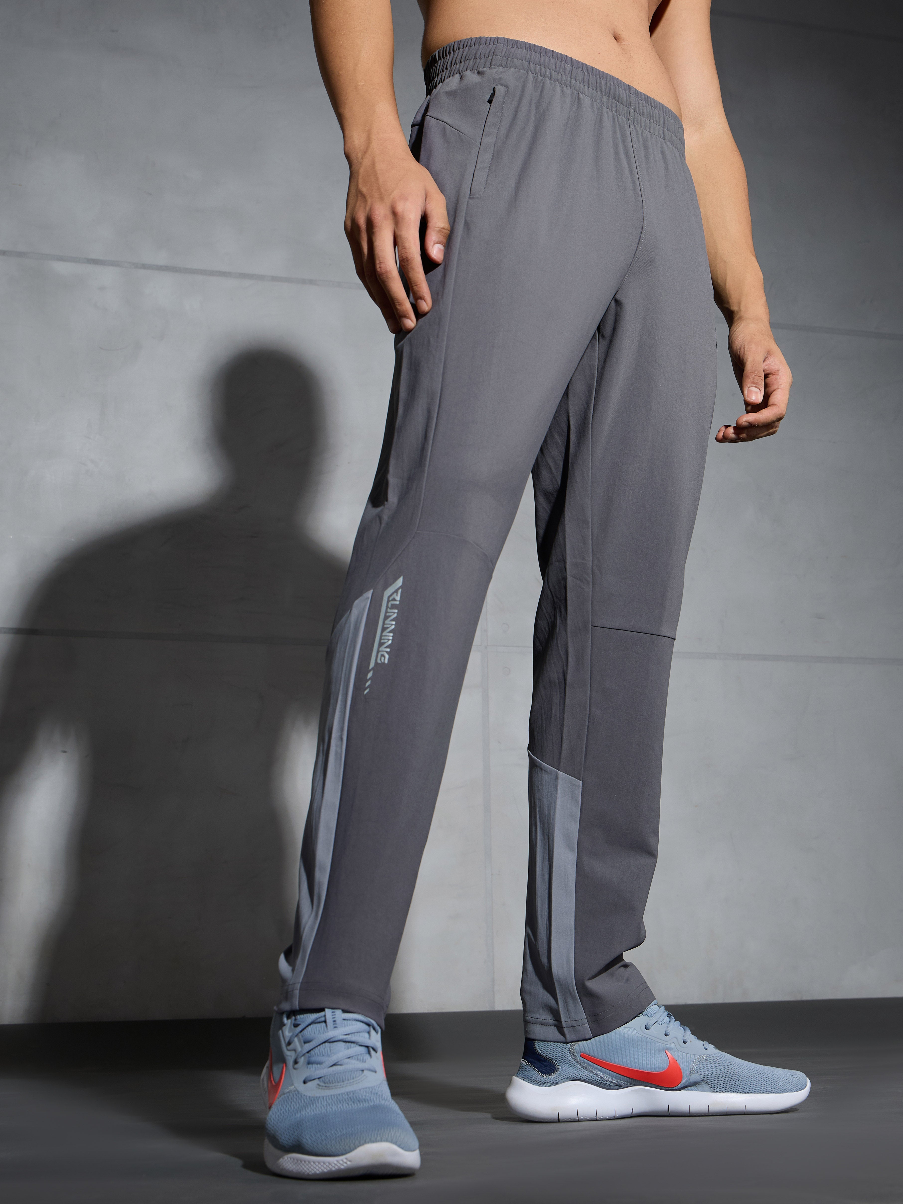 Men Solid Straight Fit Sports Trackpants with DURACOOL+